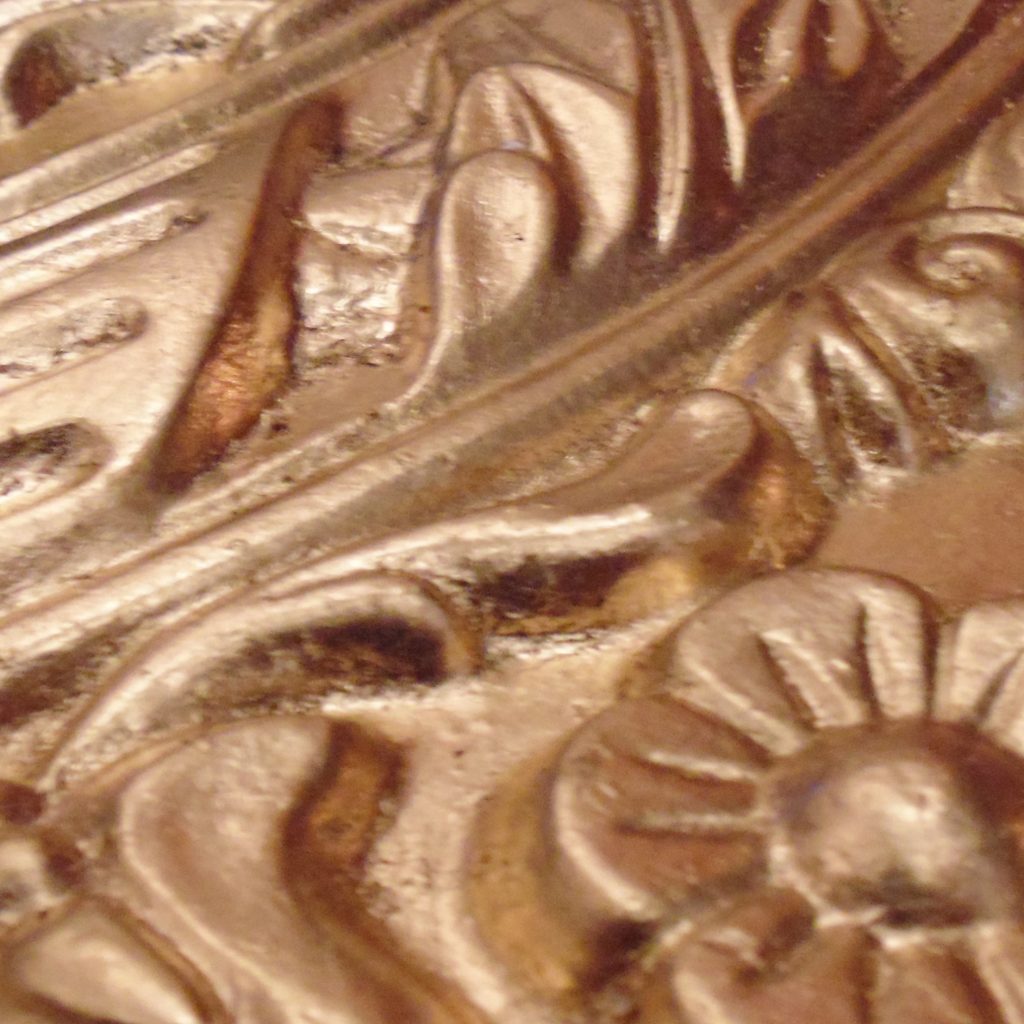 Metal Gold leaf on decorative plaster moulding detail